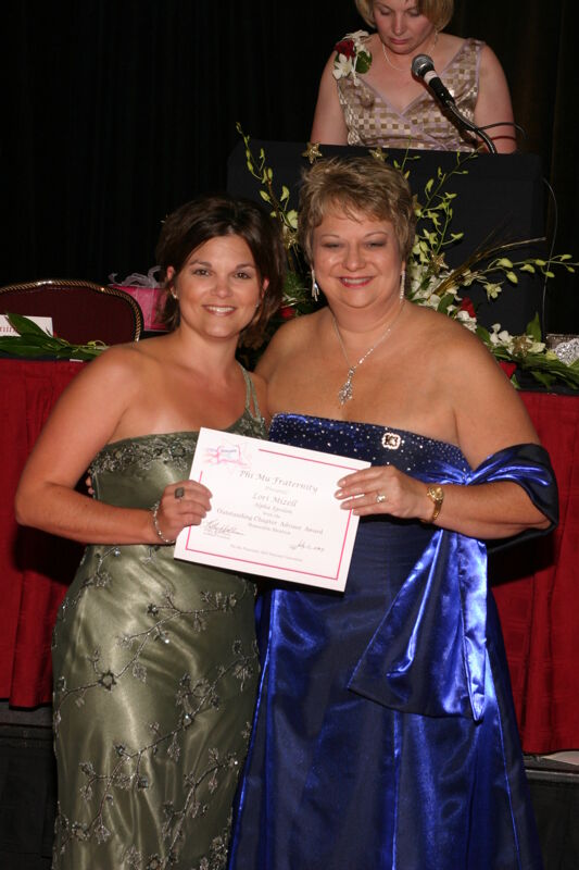 Kathy Williams and Lori Mizell With Certificate at Convention Carnation Banquet Photograph 4, July 11, 2004 (Image)