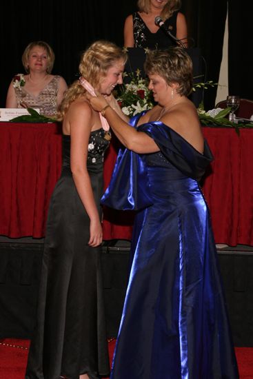 Kathy Williams Presenting Katie Burcham With Medal at Convention Carnation Banquet Photograph, July 11, 2004 (image)