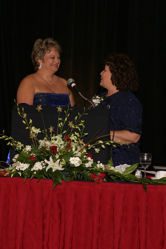 Mary Jane Johnson Speaking to Kathy Williams at Convention Carnation Banquet Photograph 3, July 11, 2004 (Image)