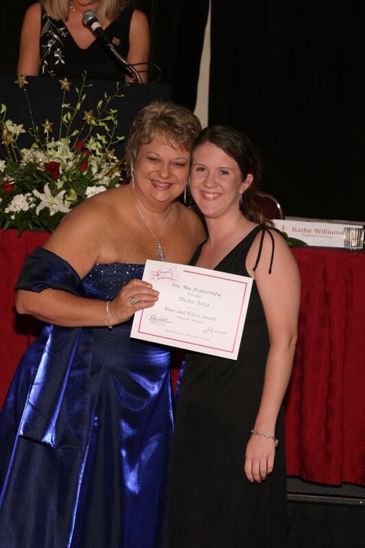 Kathy Williams and Theta Beta Chapter Member With Certificate at Convention Carnation Banquet Photograph, July 11, 2004 (Image)