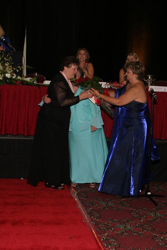 July 11 Kathy Williams Presenting Audrey Jankucic With Flowers at Convention Carnation Banquet Photograph Image
