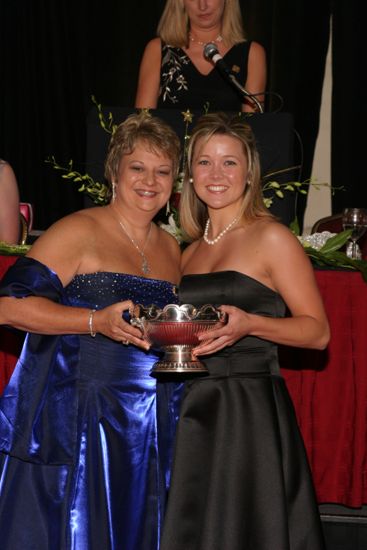 Kathy Williams and Unidentified With Award at Convention Carnation Banquet Photograph 13, July 11, 2004 (image)