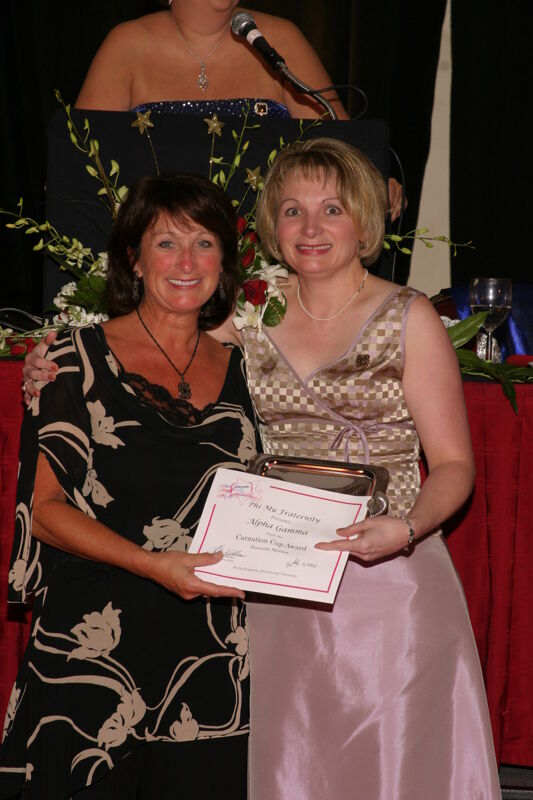 Robin Fanning and Alpha Gamma Chapter Member With Certificate at Convention Carnation Banquet Photograph, July 11, 2004 (Image)