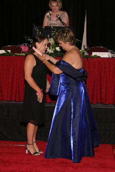 Kathy Williams Presenting Amanda Price With Medal at Convention Carnation Banquet Photograph, July 11, 2004 (image)