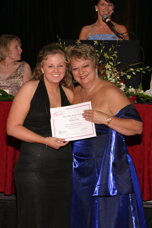 Kathy Williams and Beta Eta Chapter Member With Certificate at Convention Carnation Banquet Photograph, July 11, 2004 (Image)