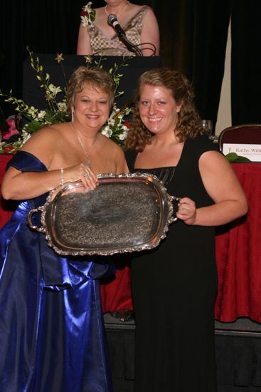 Kathy Williams and Unidentified With Award at Convention Carnation Banquet Photograph 1, July 11, 2004 (image)