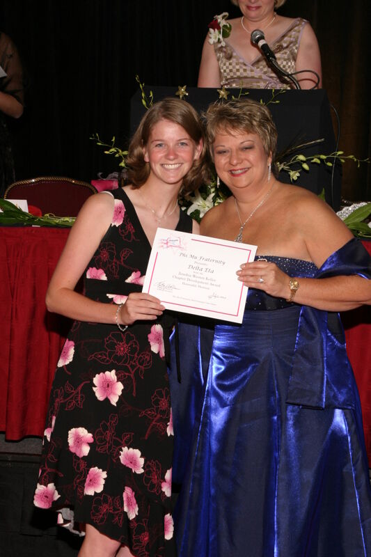 Kathy Williams and Delta Eta Chapter Member With Certificate at Convention Carnation Banquet Photograph 1, July 11, 2004 (Image)