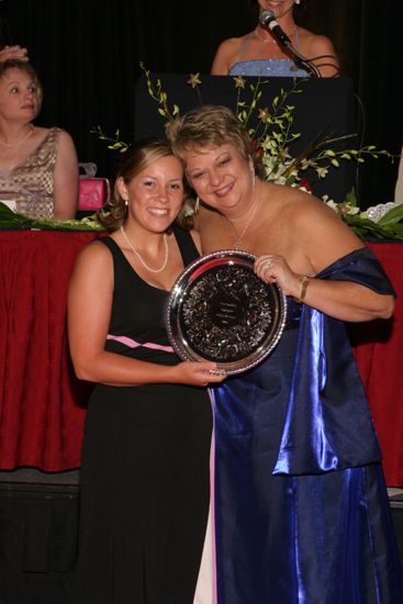 Kathy Williams and Unidentified With Award at Convention Carnation Banquet Photograph 6, July 11, 2004 (image)