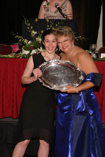 Kathy Williams and Unidentified With Award at Convention Carnation Banquet Photograph 3, July 11, 2004 (image)