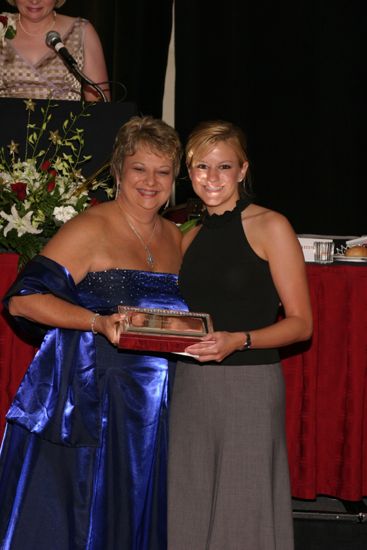 Kathy Williams and Unidentified With Award at Convention Carnation Banquet Photograph 14, July 11, 2004 (image)