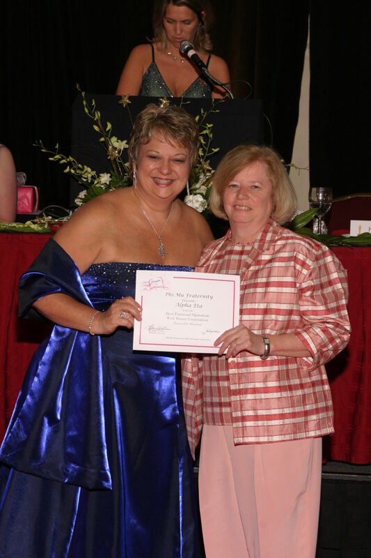 Kathy Williams and Alpha Eta Chapter Member With Certificate at Convention Carnation Banquet Photograph, July 11, 2004 (Image)