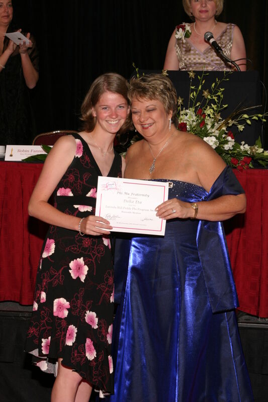 Kathy Williams and Delta Eta Chapter Member With Certificate at Convention Carnation Banquet Photograph 2, July 11, 2004 (Image)