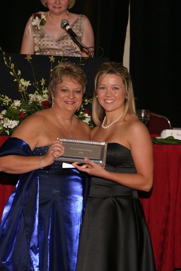 Kathy Williams and Unidentified With Award at Convention Carnation Banquet Photograph 20, July 11, 2004 (image)