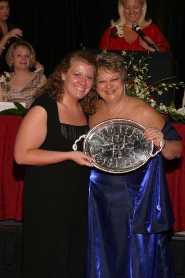 Kathy Williams and Unidentified With Award at Convention Carnation Banquet Photograph 10, July 11, 2004 (image)