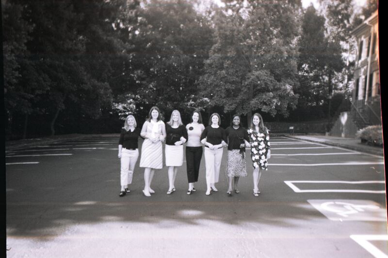 Chapter Consultants in Parking Lot During Convention Photograph 2, July 8-11, 2004 (Image)