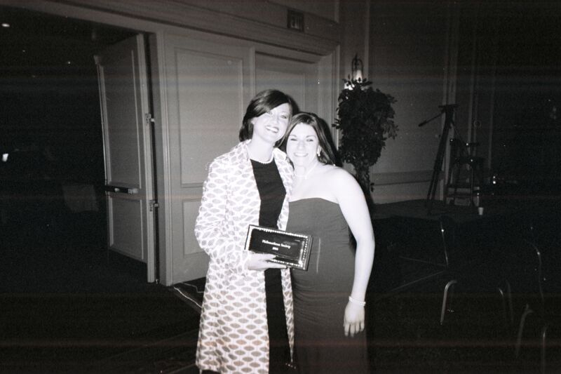 Shelly Chappuis and Unidentified With Award at Convention Carnation Banquet Photograph, July 11, 2004 (Image)