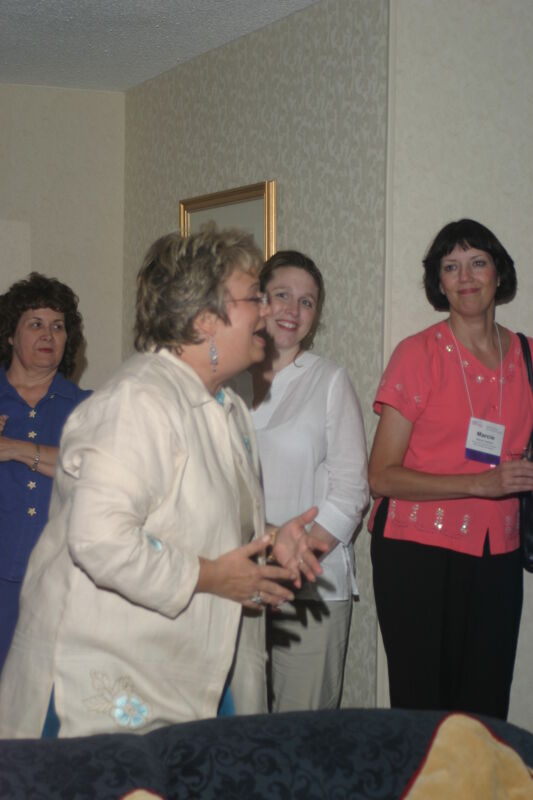 Kathy Williams Socializing at Convention Officers' Party Photograph 2, July 7, 2004 (Image)