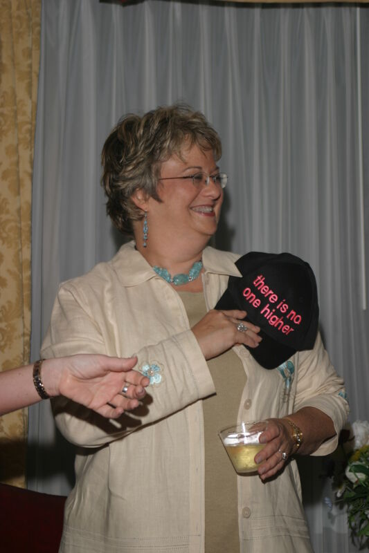July 7 Kathy Williams With Hat at Convention Officers' Party Photograph 3 Image