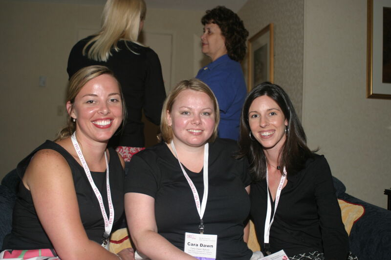 Cara Dawn Byford and Two Unidentified Phi Mus at Convention Officers' Party Photograph, July 7, 2004 (Image)