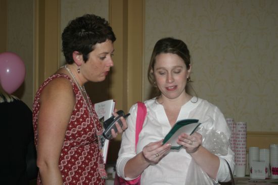 Jen Wooley and Unidentified in Convention Marketplace Photograph, July 8-11, 2004 (image)