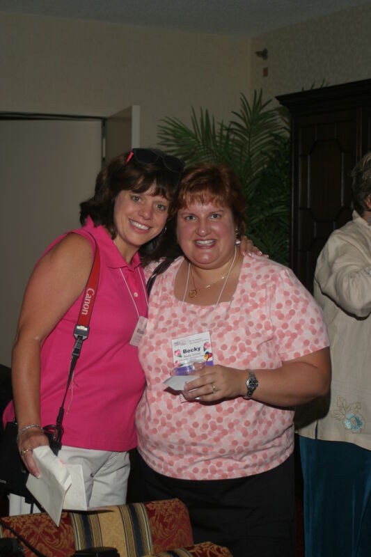 Becky School and Unidentified at Convention Officers' Party Photograph 1, July 7, 2004 (Image)