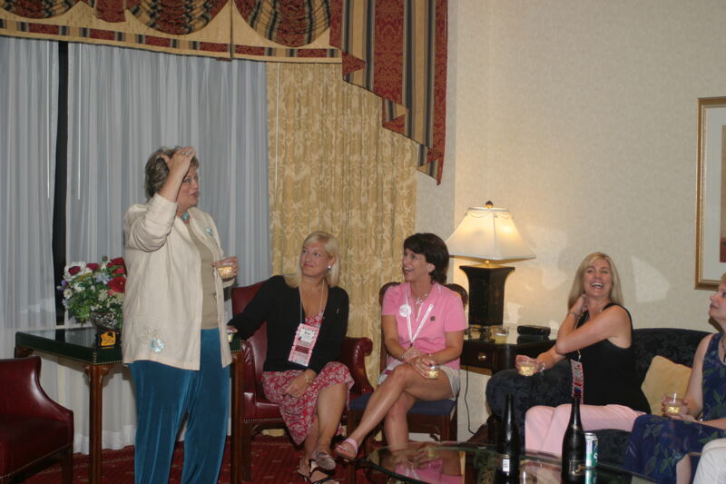 Kathy Williams Talking to Council at Convention Officers' Party Photograph 1, July 7, 2004 (Image)