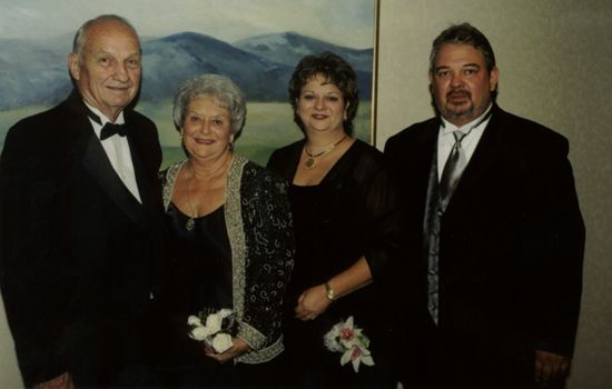 Two Phi Mus and Husbands at Carnation Banquet Photograph, July 4-8, 2002 (image)