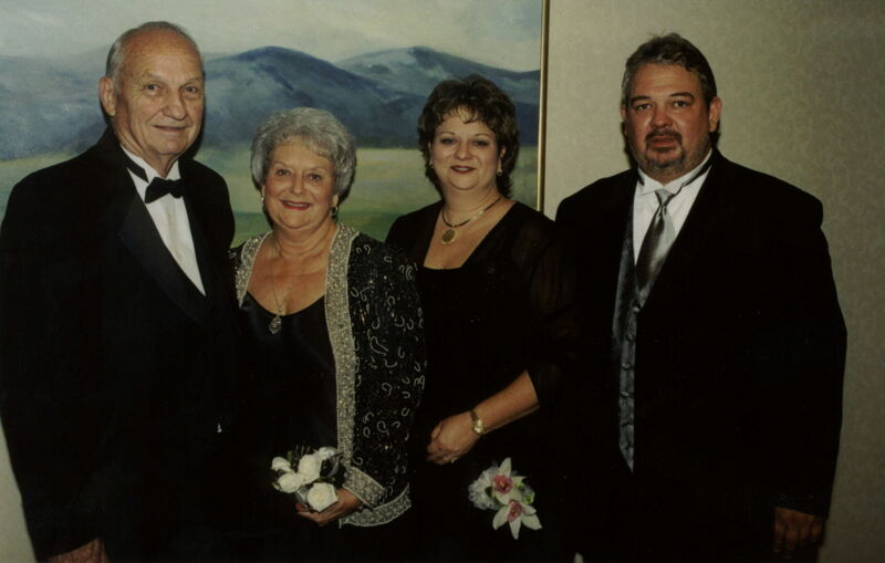 Two Phi Mus and Husbands at Carnation Banquet Photograph, July 4-8, 2002 (Image)