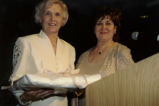 Annadell Lamb and Mary Jane Johnson With Gift at Carnation Banquet Photograph 3, July 4-8, 2002 (image)