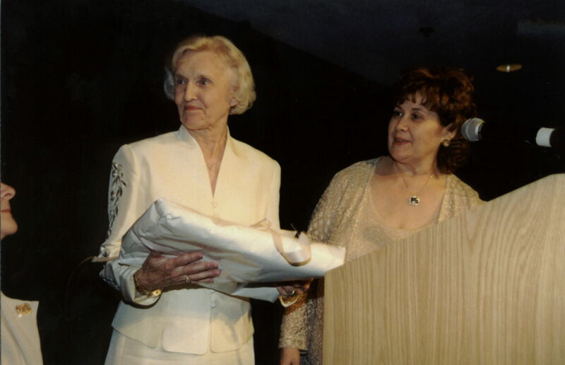 Annadell Lamb and Mary Jane Johnson With Gift at Carnation Banquet Photograph 2, July 4-8, 2002 (Image)