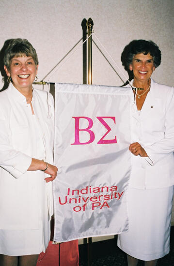 Unidentified and Pat Sackinger With Beta Sigma Chapter Banner at Convention Photograph 2, July 4-8, 2002 (image)