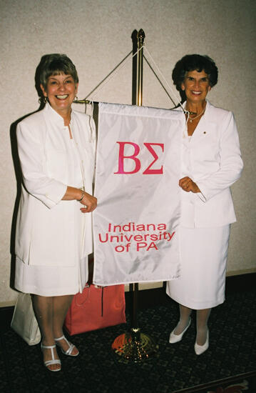 Unidentified and Pat Sackinger With Beta Sigma Chapter Banner at Convention Photograph 4, July 4-8, 2002 (image)