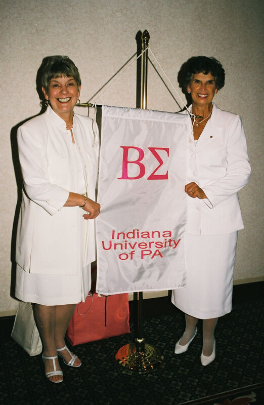 Unidentified and Pat Sackinger With Beta Sigma Chapter Banner at Convention Photograph 4, July 4-8, 2002 (Image)