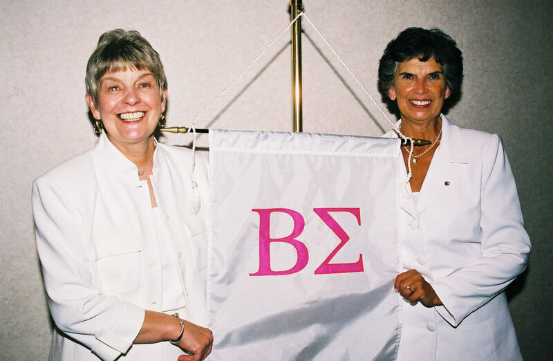 Unidentified and Pat Sackinger With Beta Sigma Chapter Banner at Convention Photograph 3, July 4-8, 2002 (Image)