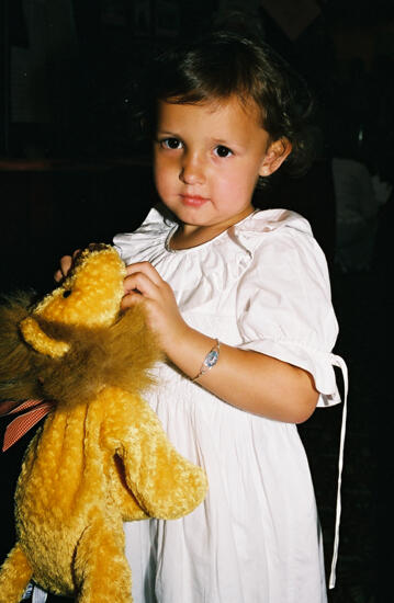 Young Girl With Stuffed Lion at Convention Photograph, July 4-8, 2002 (image)