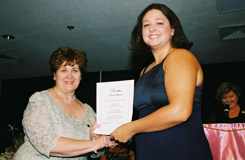 Mary Jane Johnson and Kappa Phi Chapter Member With Certificate at Convention Photograph, July 4-8, 2002 (Image)