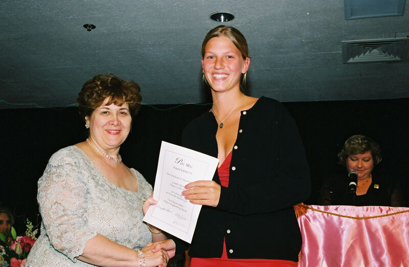 Mary Jane Johnson and Lambda Alpha Chapter Member With Certificate at Convention Photograph, July 4-8, 2002 (Image)