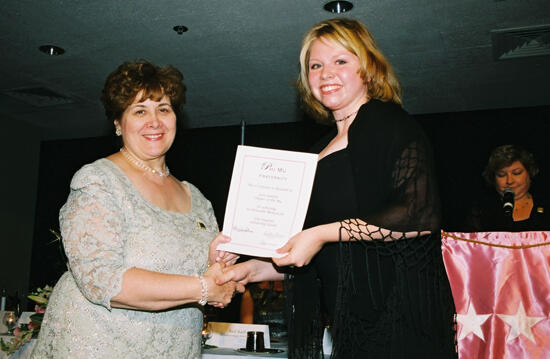 Mary Jane Johnson and Zeta Lambda Chapter Member With Certificate at Convention Photograph, July 4-8, 2002 (image)