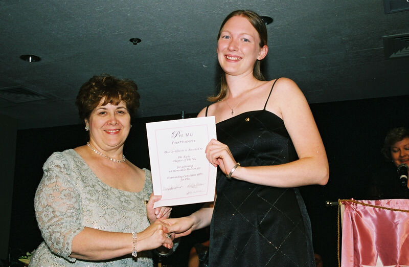 Mary Jane Johnson and Phi Alpha Chapter Member With Certificate at Convention Photograph, July 4-8, 2002 (Image)