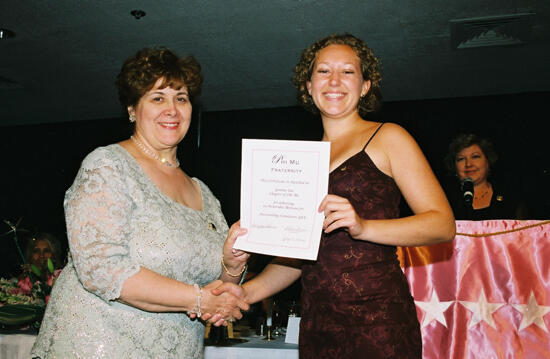 Mary Jane Johnson and Gamma Tau Chapter Member With Certificate at Convention Photograph, July 4-8, 2002 (image)