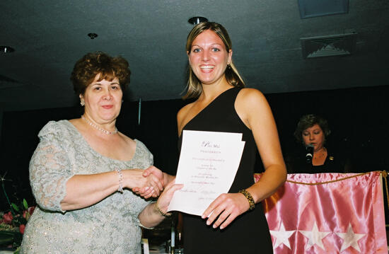 Mary Jane Johnson and Gamma Nu Chapter Member With Certificate at Convention Photograph, July 4-8, 2002 (image)