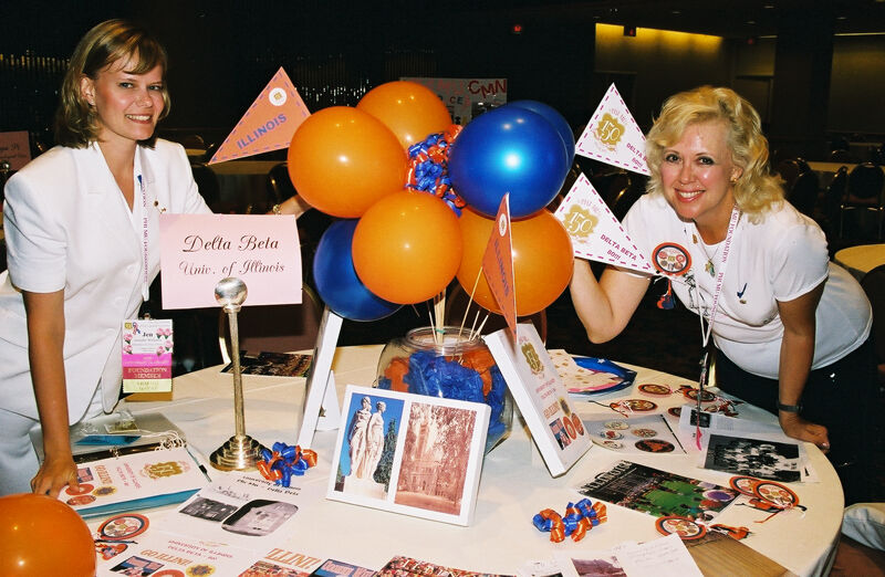 Two Phi Mus by Delta Beta Chapter Reunion Table at Convention Photograph 2, July 4-8, 2002 (Image)