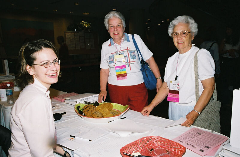Ruth and Martha Selecting Cookies at Convention Photograph 2, July 4-8, 2002 (Image)