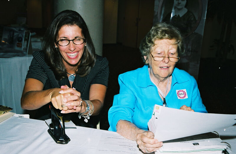 Two Phi Mus With a Seal Press at Convention Photograph, July 4-8, 2002 (Image)