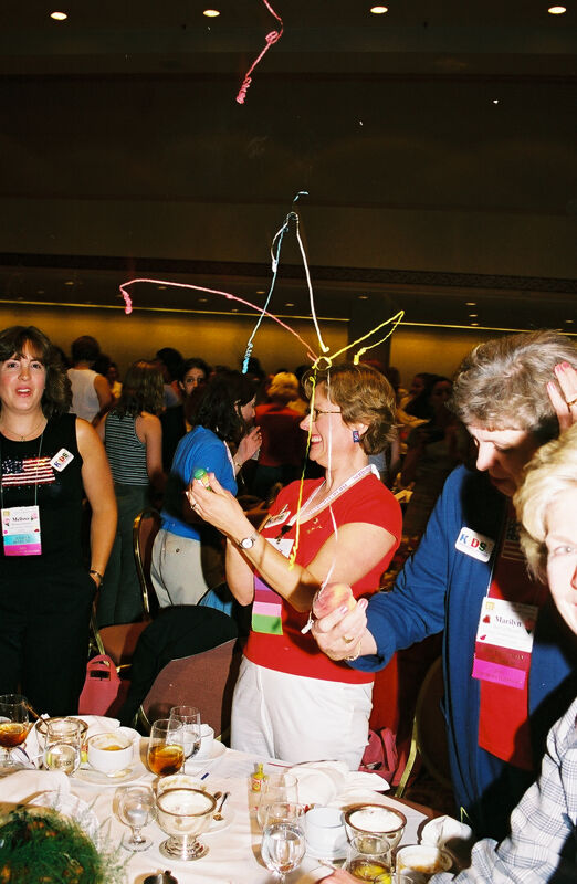 Phi Mus Setting Off Poppers at Convention Photograph 2, July 4, 2002 (Image)