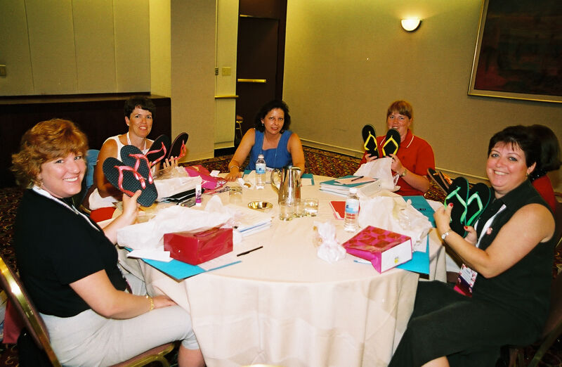 Table of Phi Mus With Sandals at Convention Photograph, July 4-8, 2002 (Image)