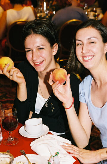 Two Phi Mus Holding Peaches at Convention Photograph 2, July 4-8, 2002 (image)