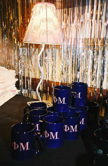 Phi Mu Mugs in Convention Carnation Shop Photograph, July 4-8, 2002 (image)