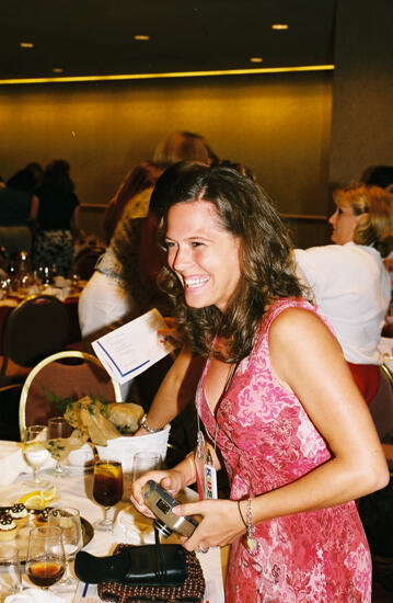 Unidentified Phi Mu in Pink Dress at Convention Dinner Photograph, July 4-8, 2002 (image)