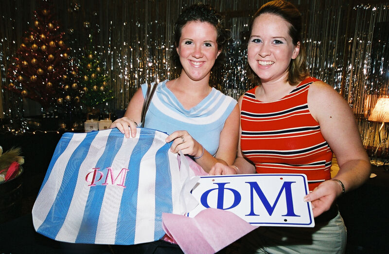July 4-8 Two Members With Phi Mu Merchandise at Convention Photograph 2 Image